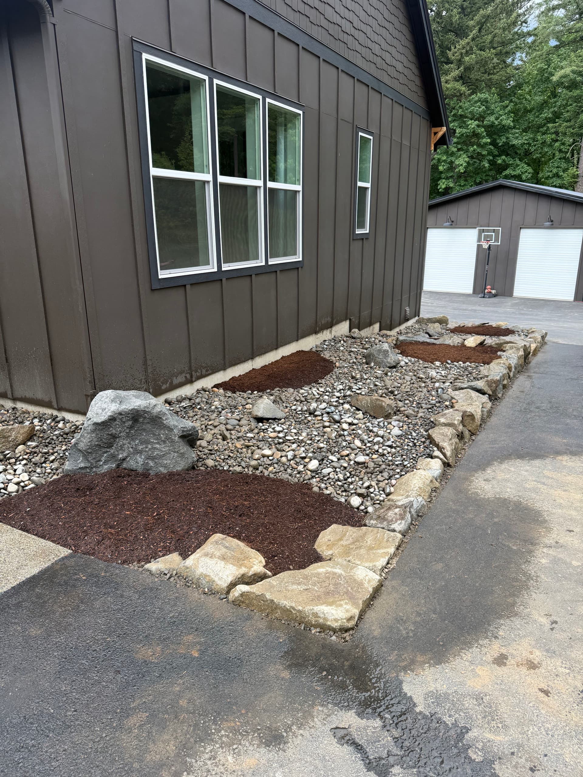 Clean Stone Edging and Mulch Beds That Make a Front Entry Pop image