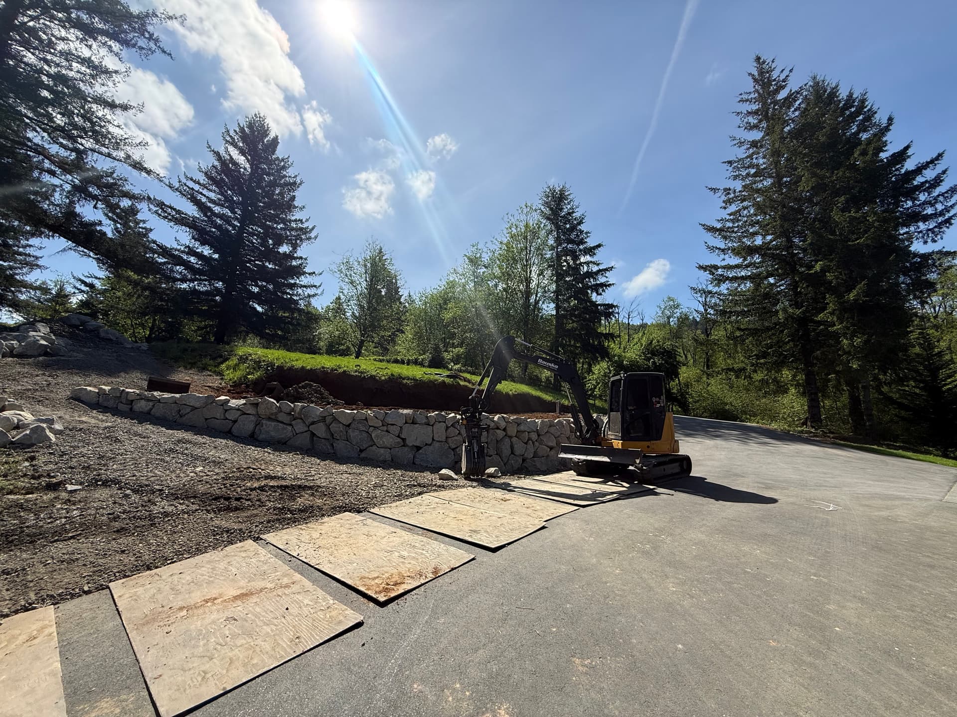 Excavation and Stone Retaining Wall Work in Progress image