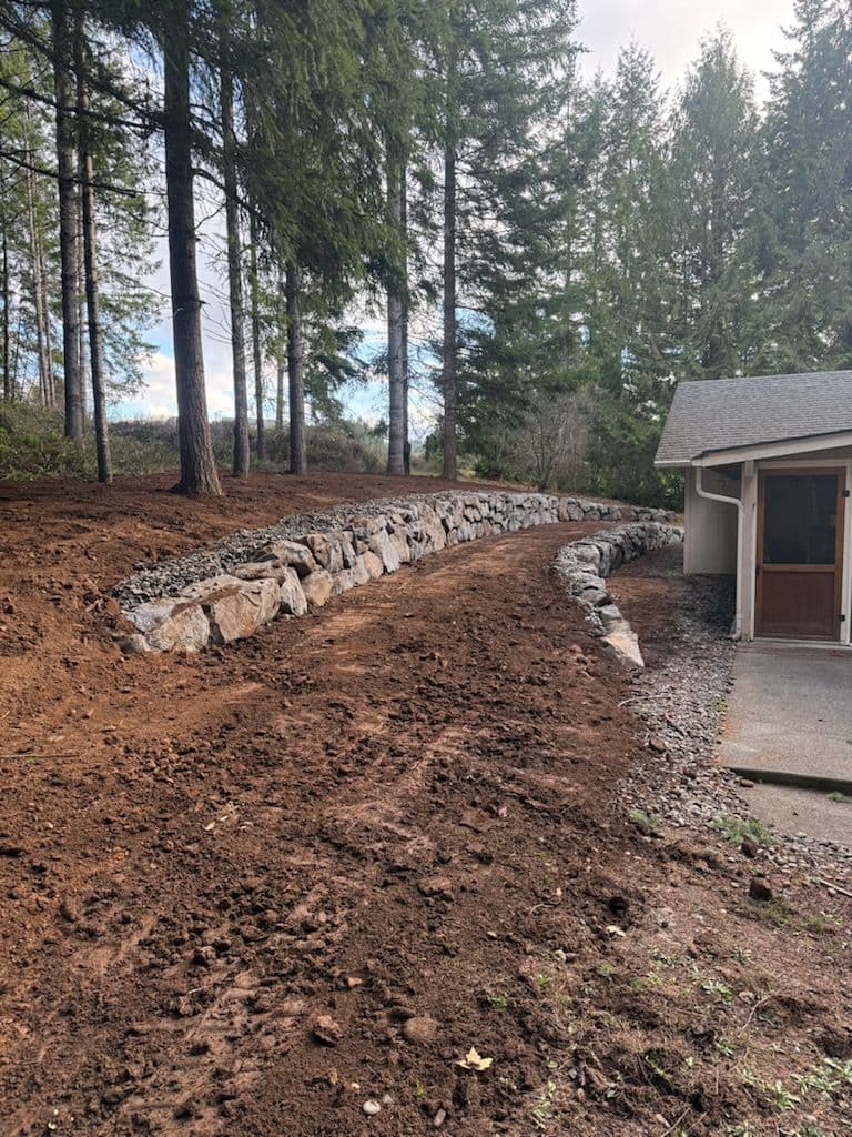 Project Serene Outdoor Makeover with Stone Pathway and Retaining Wall image