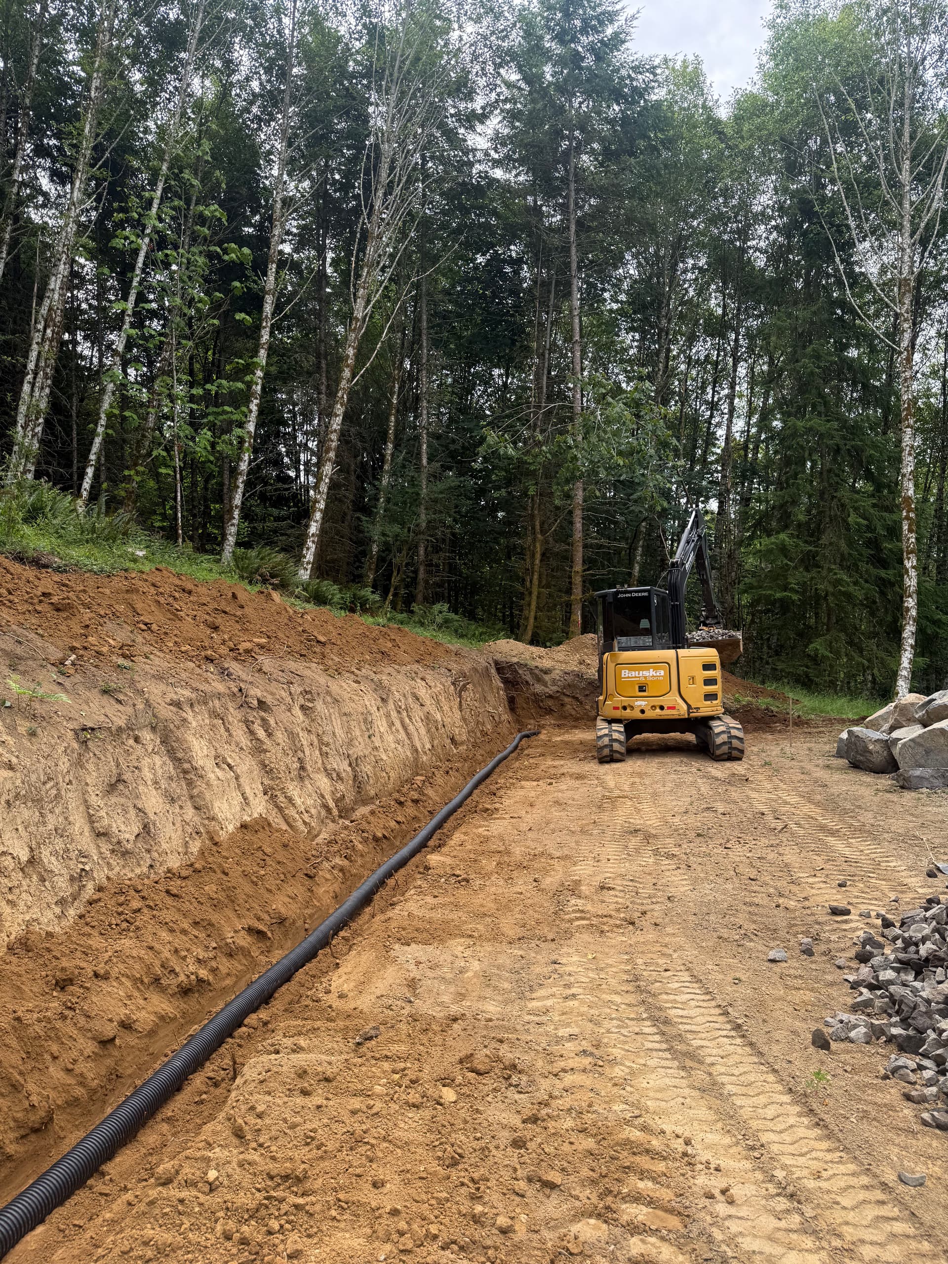Boulder Wall Drainage Done Right Before the First Stone Goes In image